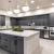 a kitchen with stainless steel appliances and a large island